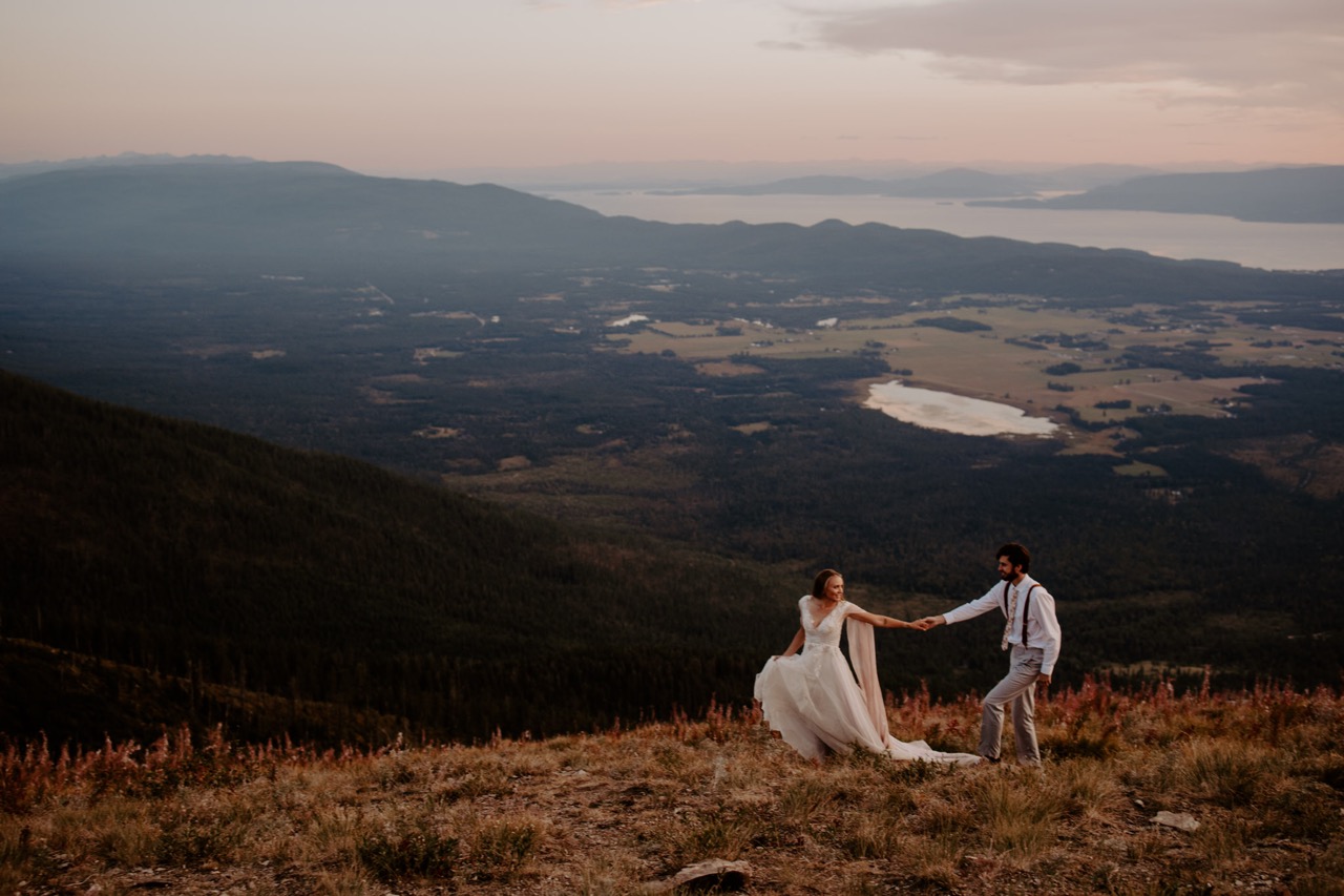 Bride and Groom walking in the mountains in montana