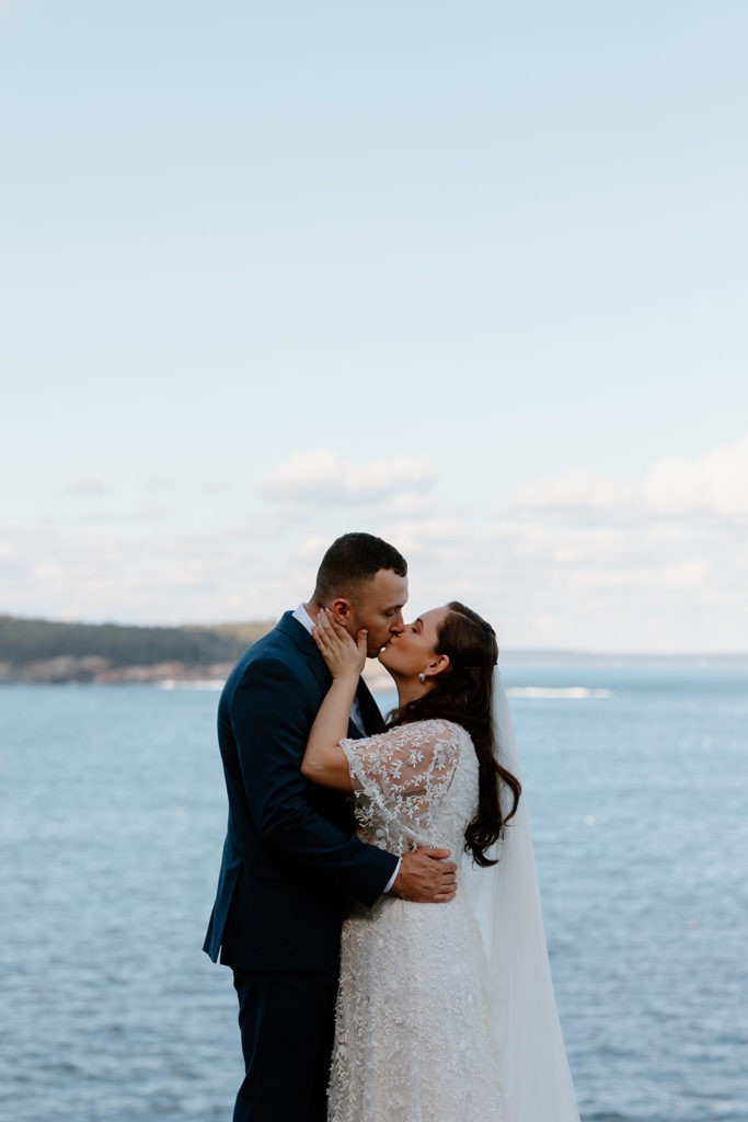 couple kissing in Acadia Maine, elopement planning