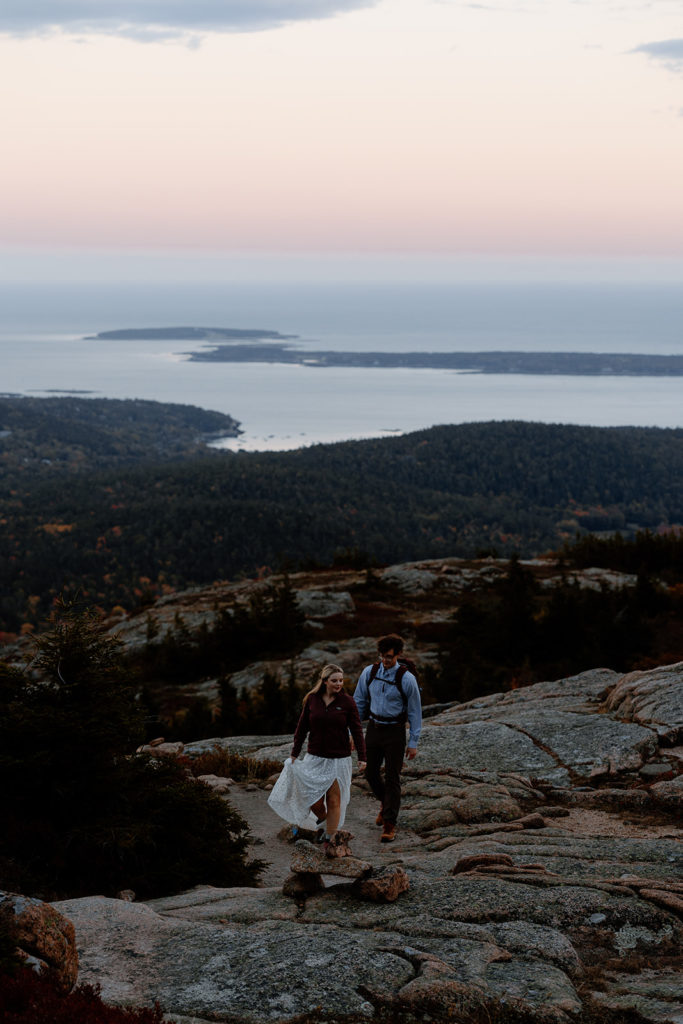 couple hiking on Maine coast