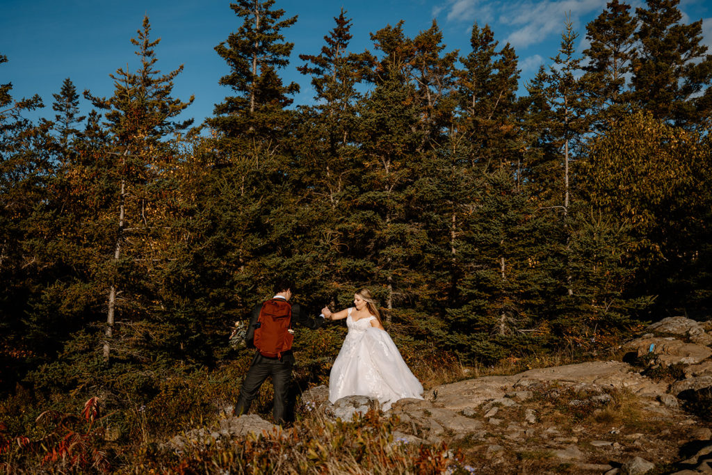 hiking in Acadia in wedding attire