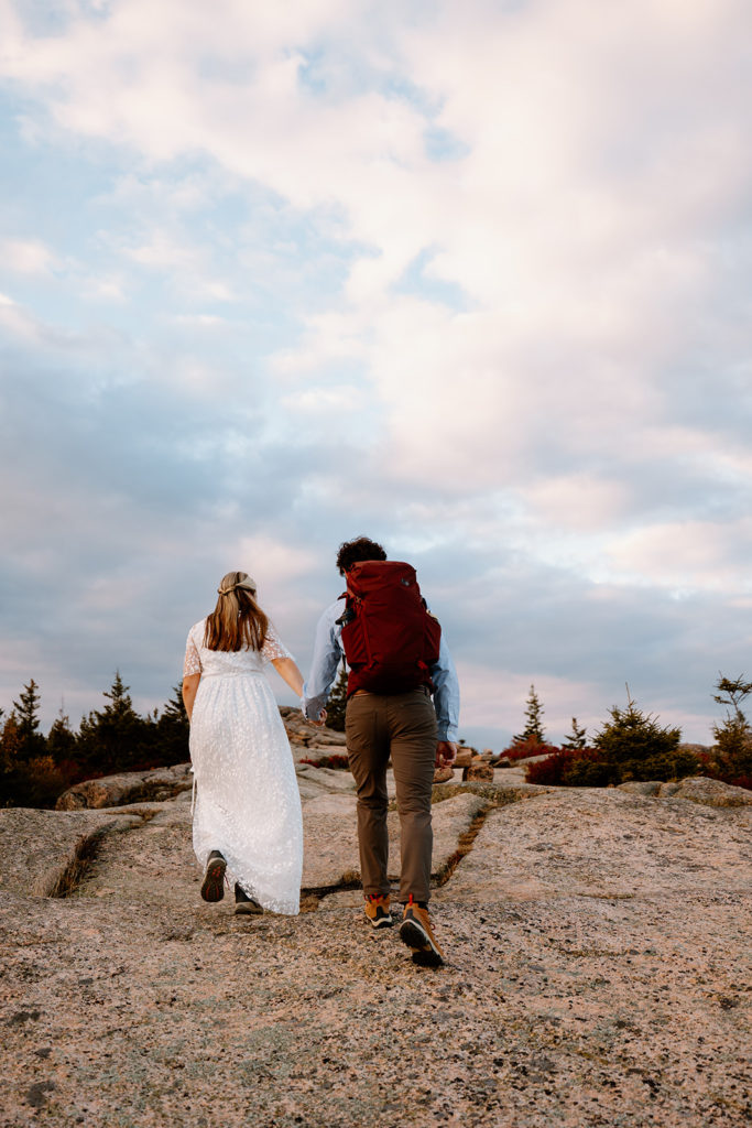 couple hiking for elopement in Acadia