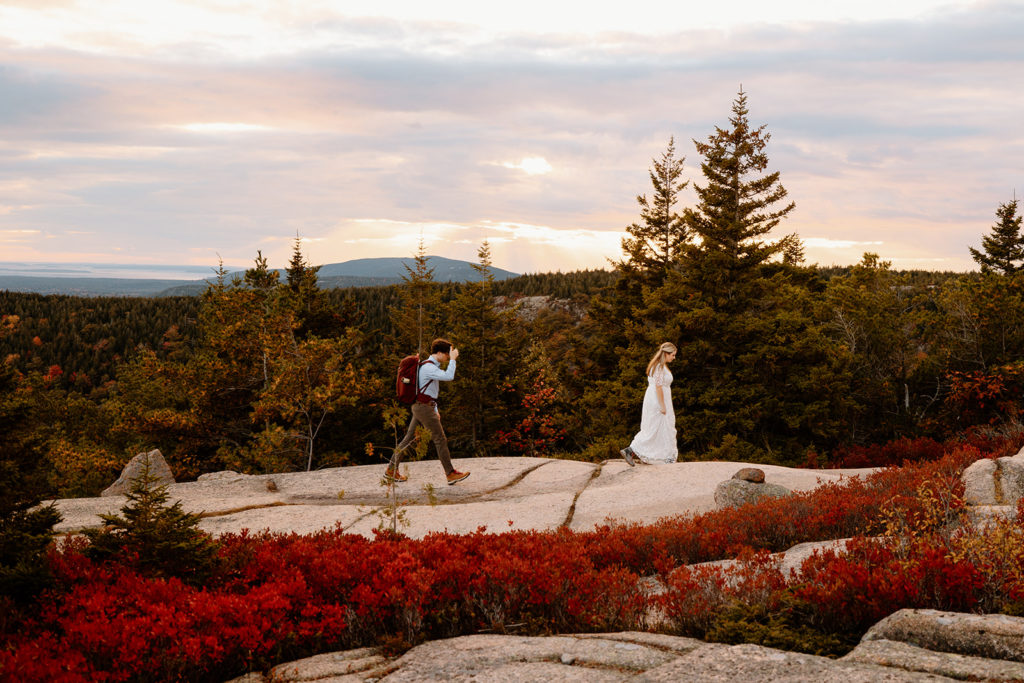 elopement couple hiking in Acadia in autumn